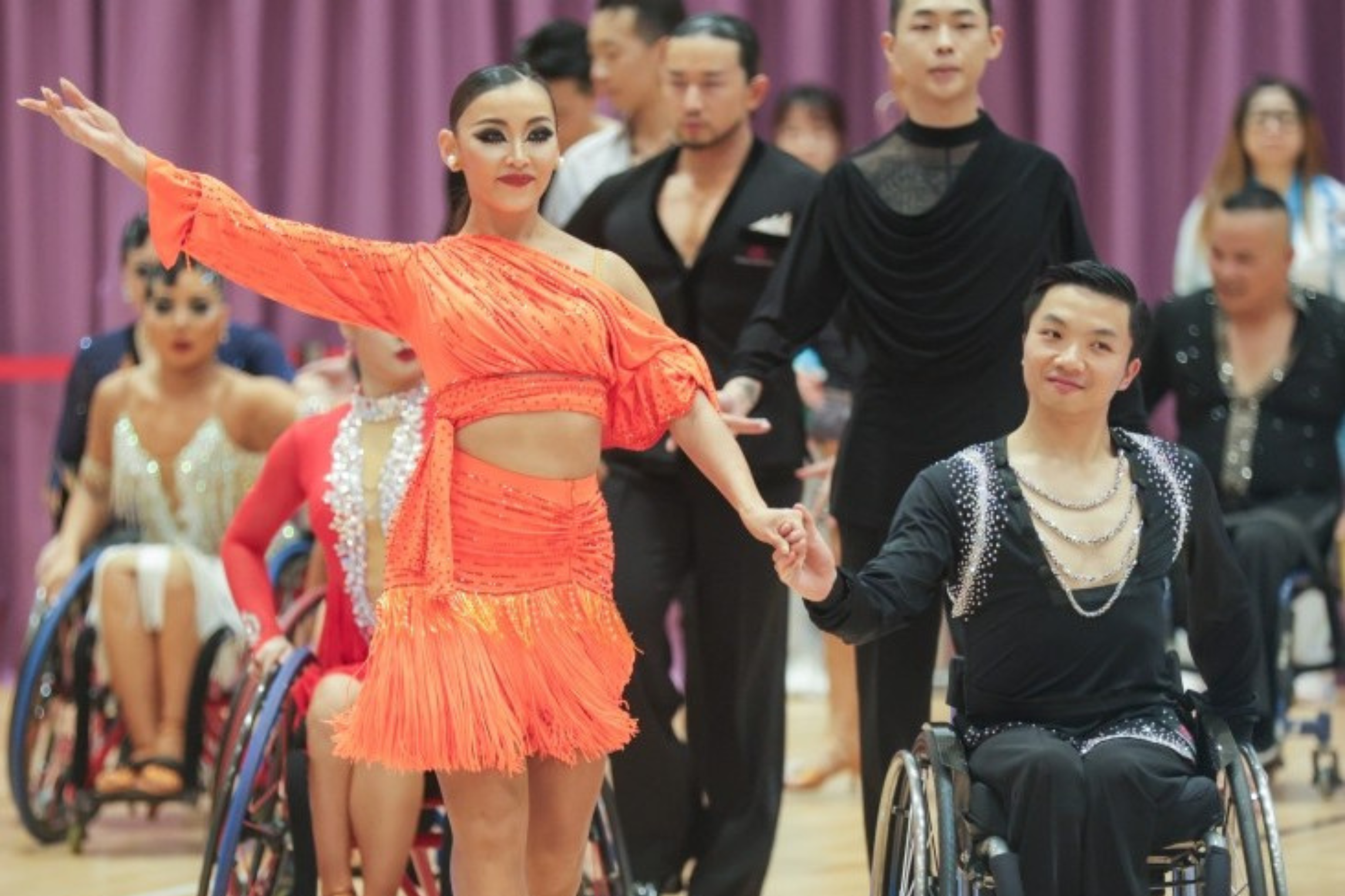 Matthew Yu Chun-yin (right) sweeps three gold medals in wheelchair dance.